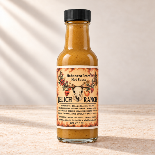 Jelich Ranch Habanero Peach Hot Sauce, 5 oz, with the skull-and-antler label and JelichOrganic.com. Digital product rendering.